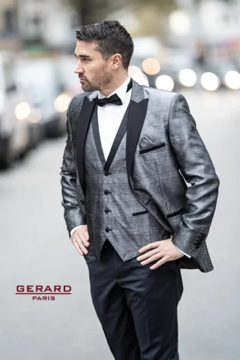 Monte Carlo Glamour Wedding Suit in metallic silver with black satin lapels, featuring a matching vest and black bow tie