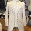 Santiago Beige Color wedding suit with frock coat, open front design, floral-patterned vest, and cravat-style tie